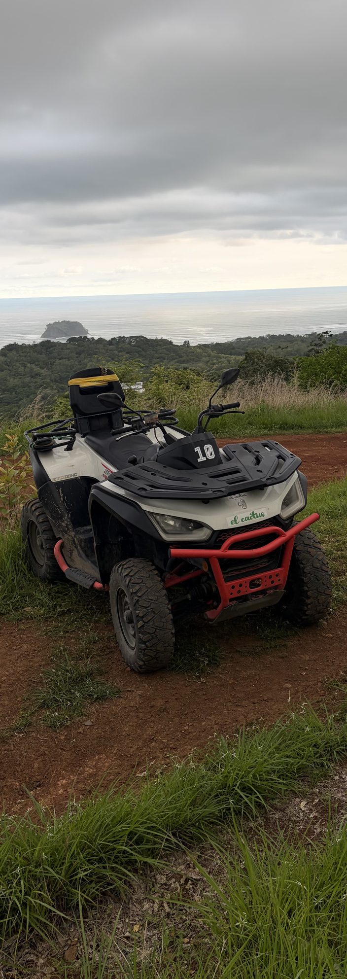 Cactus ATV parked on a hilltop overlooking the Pacific coast