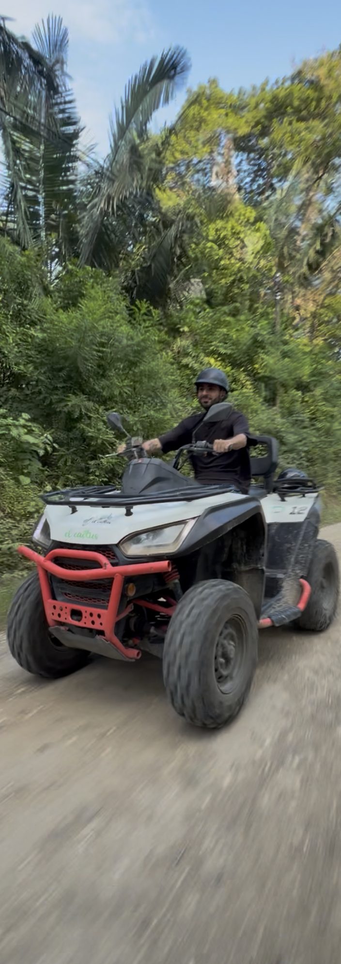 Rider on an ATV on a jungle trail near Sámara