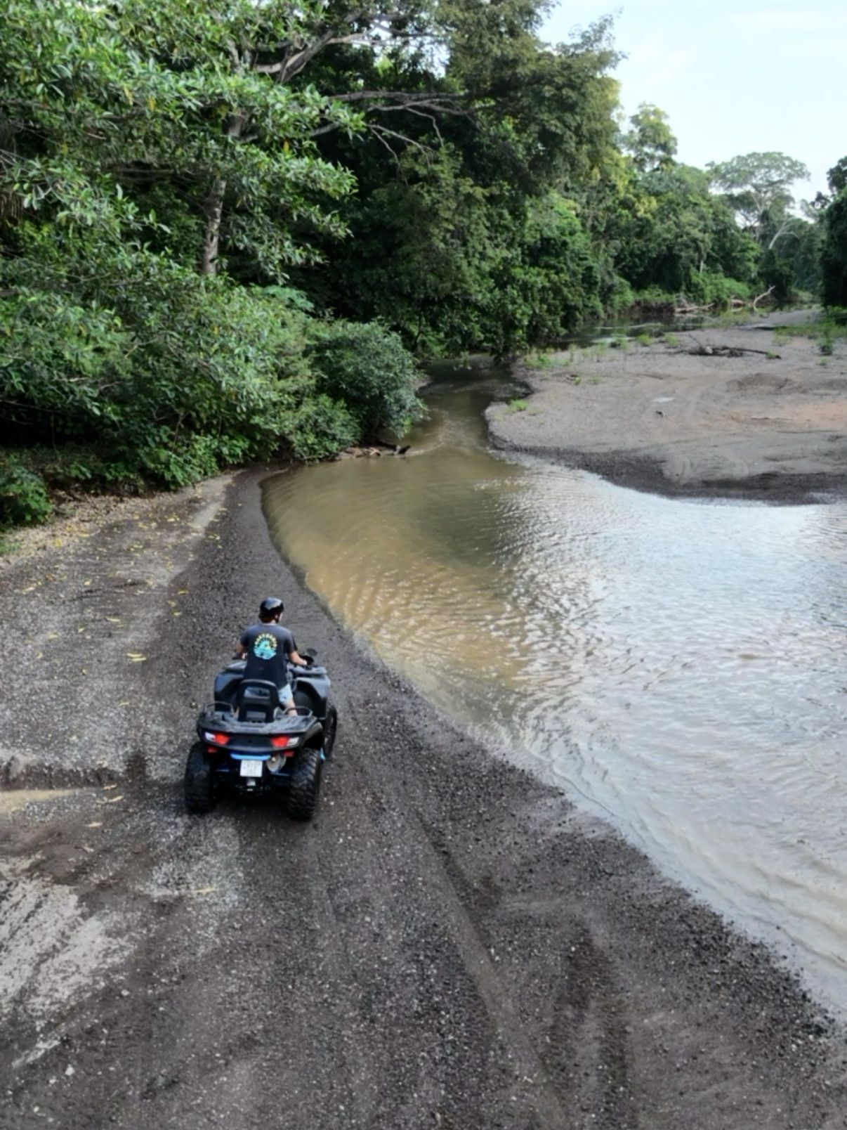 ATV tour crossing a river near Sámara